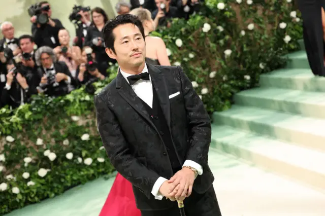 Steven Yeun attends The 2024 Met Gala Celebrating "Sleeping Beauties: Reawakening Fashion" at The Metropolitan Museum of Art on May 06, 2024 in New York City