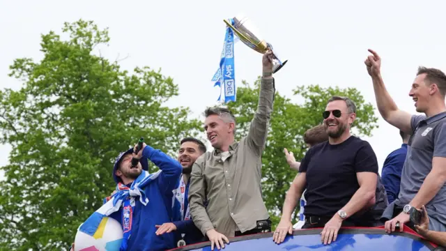 Ipswich Town players and Kieran McKenna on the open-top bus during the promotion parade