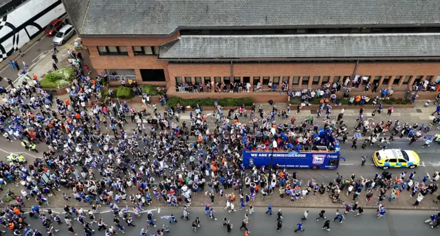 An aerial photograph of Ipswich Town promotion celebrations as an open-top bus passes through the town centre