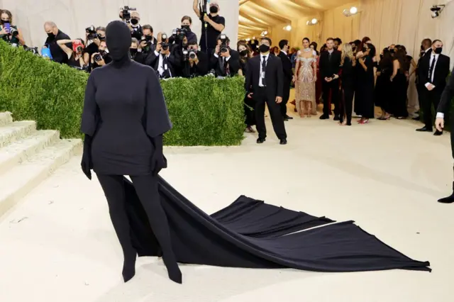 Kim Kardashian showed up in a full-body, faceless black outfit designed by Balenciaga’s creative director Demna Gvasalia for the 2021 Met Gala ‘In America: A Lexicon Of Fashion’