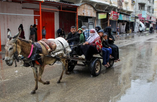 People flee the eastern parts of Rafah after the Israeli military began evacuating Palestinian civilians, 6 May 2024