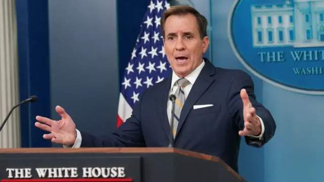 White House spokesperson John Kirby gestures while talking to reporters