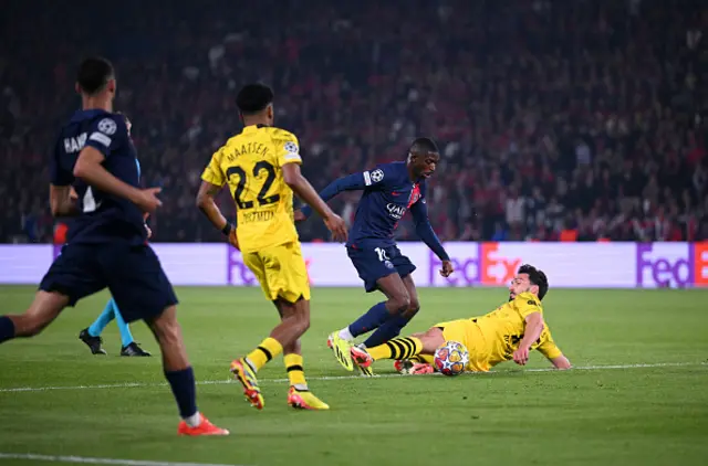 Ousmane Dembele of Paris Saint-Germain is fouled by Mats Hummels of Borussia Dortmund