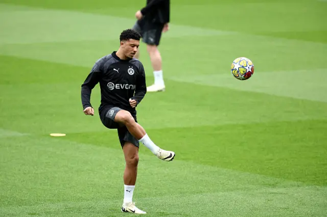 Jadon Sancho controls the ball during a training session