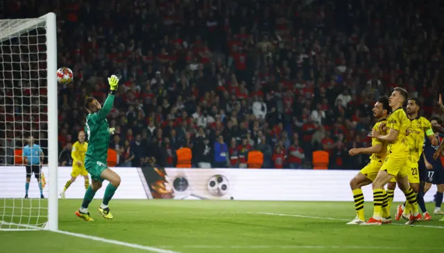 Borussia Dortmund's Mats Hummels scores their second goal past Paris St Germain's Gianluigi Donnarumma before it is disallowed