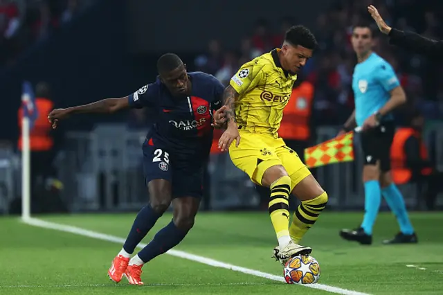 Jadon Sancho controls the ball under pressure