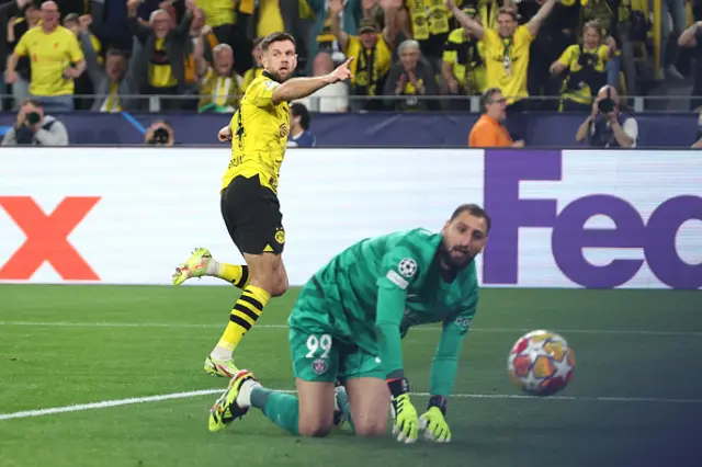 Niclas Fuellkrug of Borussia Dortmund celebrates as goalkeeper Donnarumma looks on