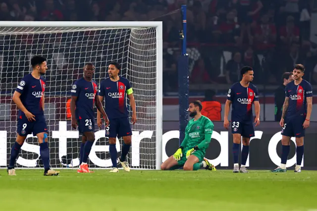 Paris Saint-Germain players react following the opening goal