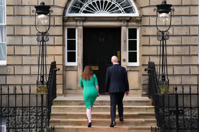 Deputy First Minister Kate Forbes and First Minister John Swinney return