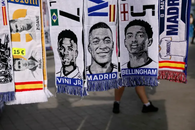 Scarves with Madrid players and Mbappe's face on