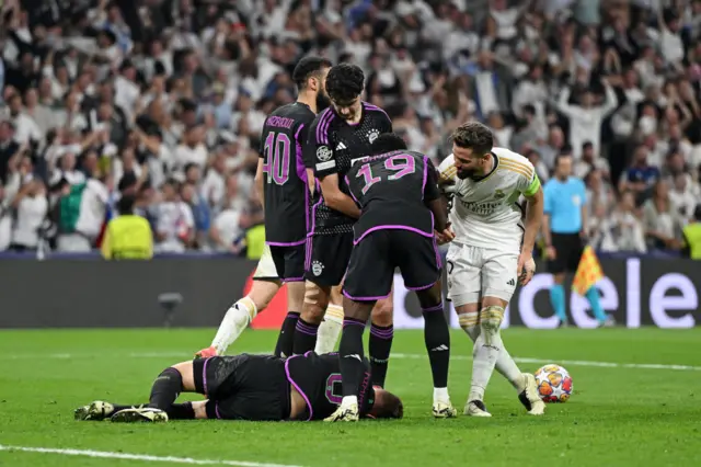 Kimmich lies stricken after the challenge from Nacho