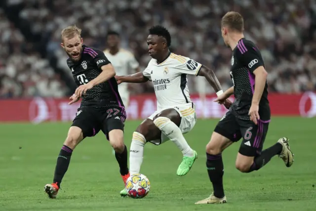 Vinicius runs past Laimer and Dier