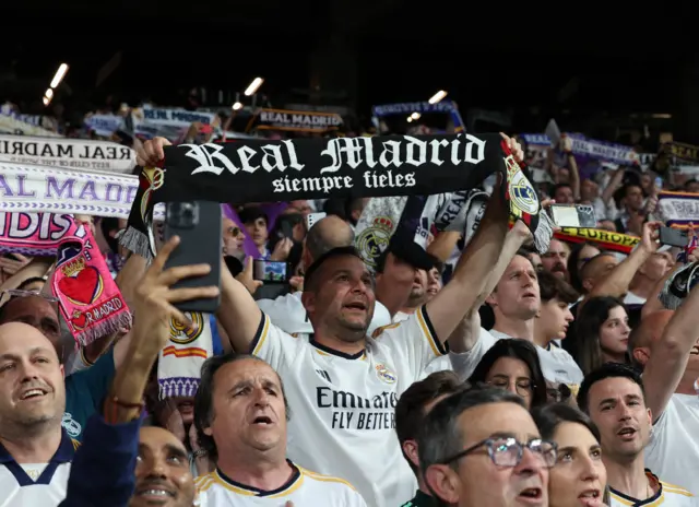 Madrid fans sing the club anthem before kick off