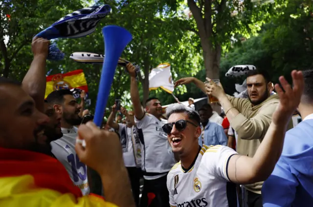 Madrid fans sing outside the ground