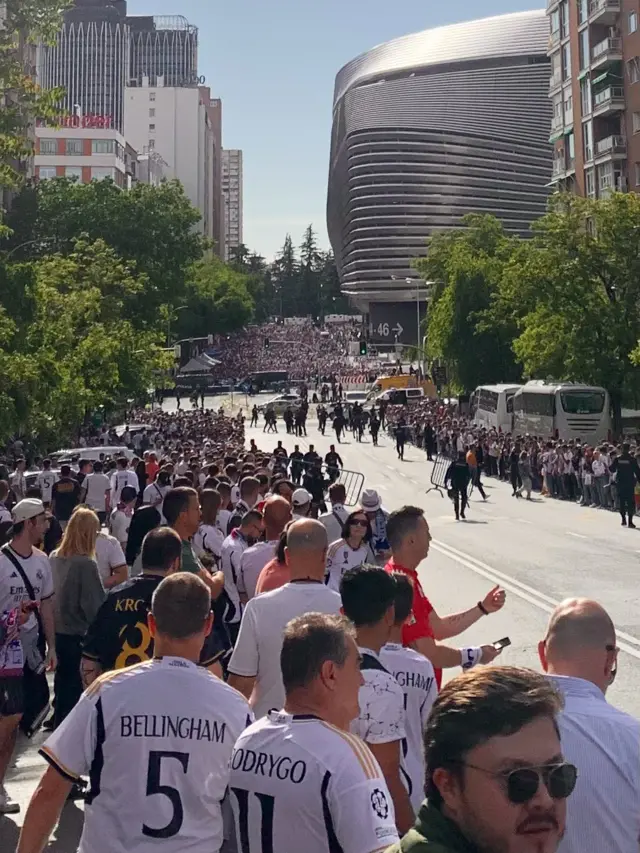 Fans gather outside the Bernabeu to wait for the arrival of the team bus