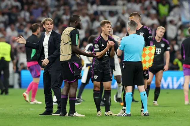 Bayern players remonstrate with the officials at full time