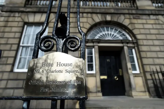 Gold sign reading 'Bute House No 6 Charlotte Swuare Official Residence of The First Minister'