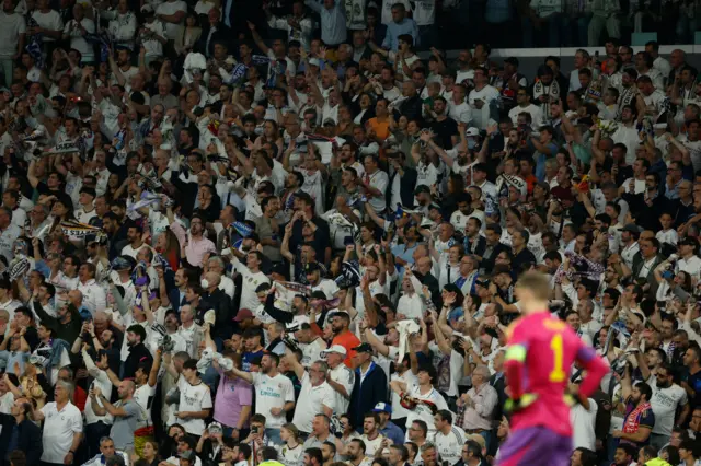 Fans sing as Neuer stands stunned