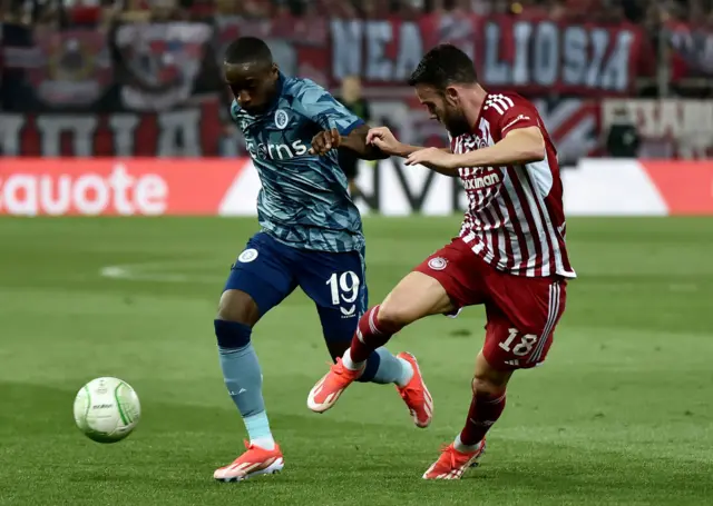 Moussa Diaby of Aston Villa on the ball whilst under pressure from Quini Marin of Olympiakos