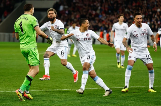 Aston Villa players celebrate beating Lille on penalties