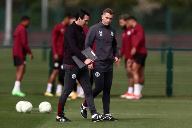 Emery talks to one of his assistants in training