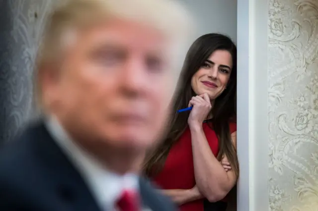 A file photo from 2018 of Madeleine Westerhout watches as Donald Trump speaks during a White House meeting