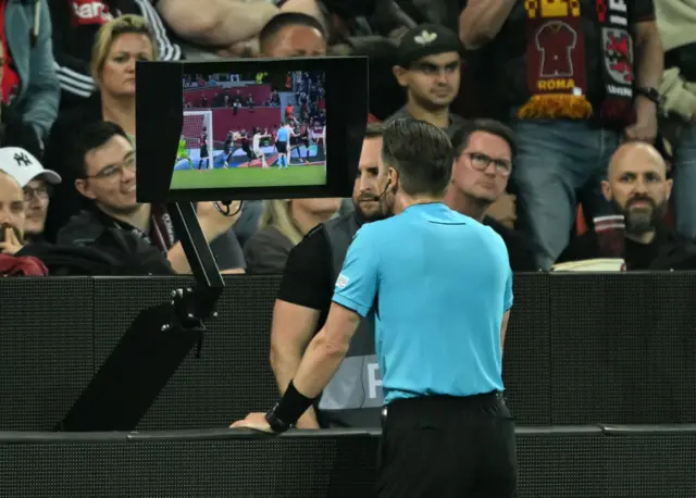 Referee at the VAR monitor