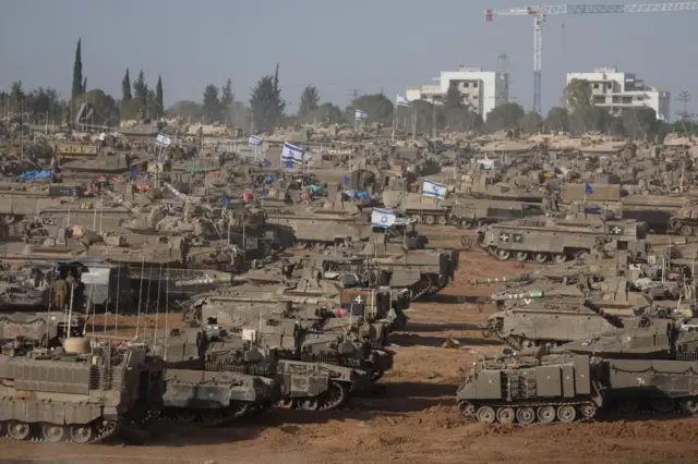 Israeli tanks in southern Israel, near the Gaza border fence, on Thursday