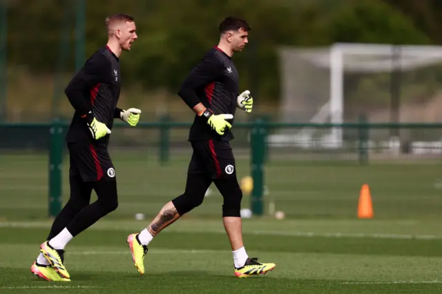 Martinez and Olsen run out onto the training pitch