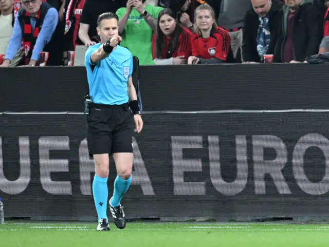 Dutch referee Danny Makkelie signals a penalty for ASC Roma during the UEFA Europa League semi final second leg football match between Bayer Leverkusen and ASC Roma in Leverkusen, on May 9, 2024.