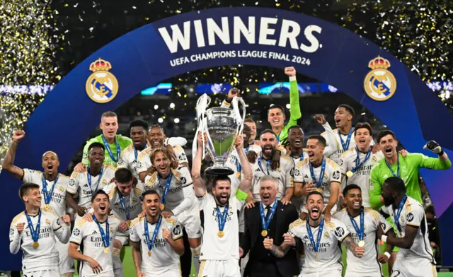 Nacho lifts the UCL trophy on the Wembley pitch