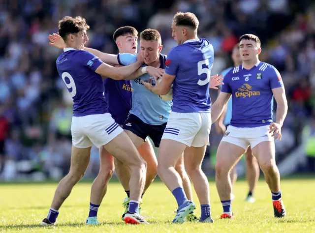 Cavan trio Brían O'Connell, Cian Reilly and Padraig Faulkner surround Dublin's Paddy Small