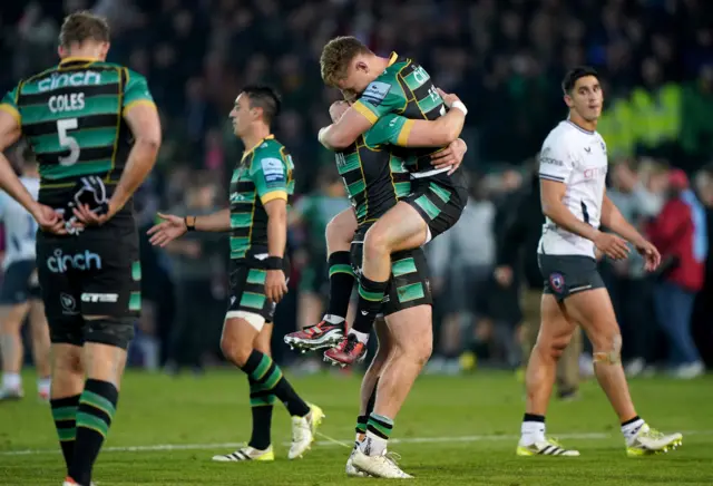 Northampton players celebrate their win over Saracens