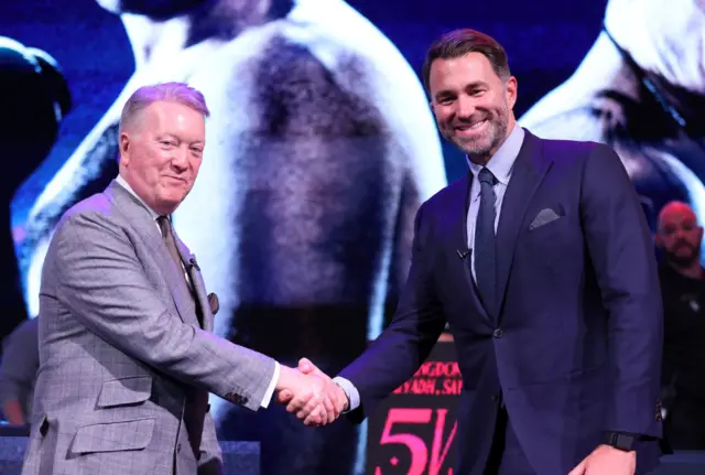 Frank Warren and Eddie Hearn shake hands