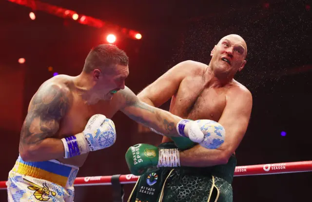 Oleksandr Usyk lands a punch on Tyson Fury