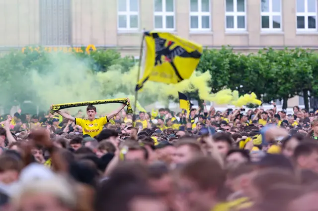 Dortmund fans in a fan zone back home