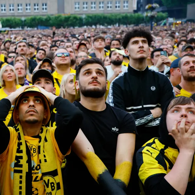 Dortmund fans in a fan zone back home