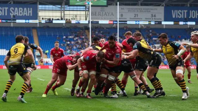 Scarlets power over for the game's first try