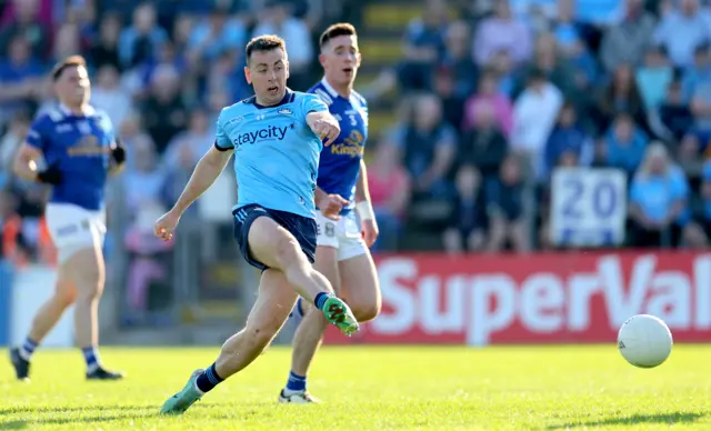 Cormac Costello fires low into the Cavan net for Dublin's first goal