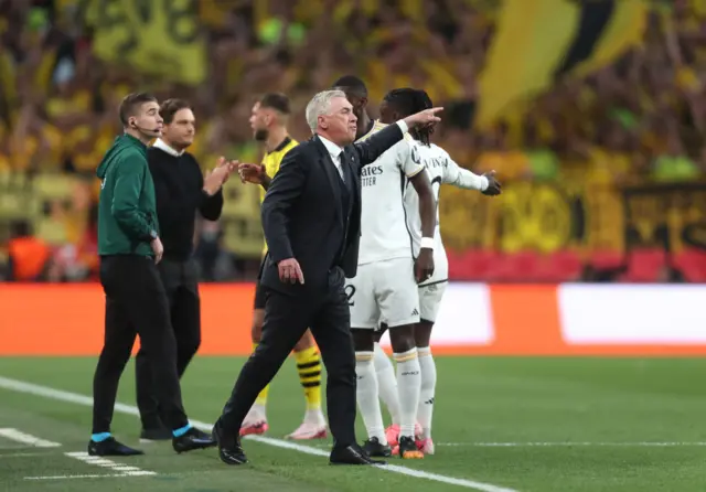 Ancelotti directs his players from the touchline