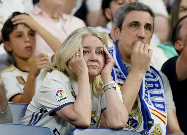 Madrid fan reacts in the stadium back home