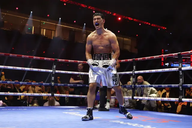 Dmitry Bivol celebrates in the ring