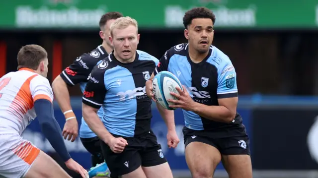 Ben Thomas carries the ball for Cardiff