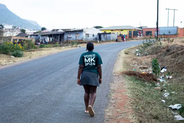 An MK supporter walks on a street in KwaXimba, South Africa - 31 May 2024