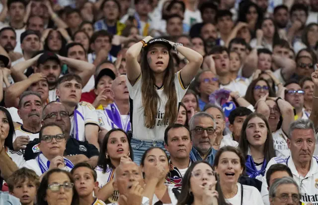 Madrid fan reacts in the stadium back home