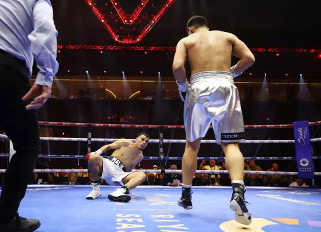 Dmitry Bivol puts Malik Zinad down in the first round