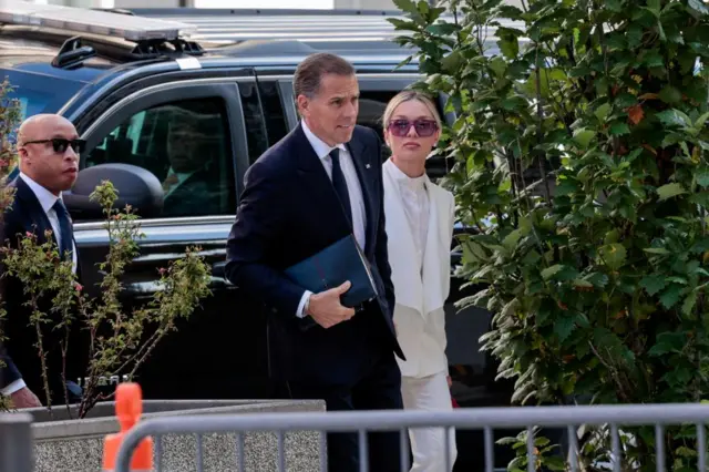 Hunter Biden and his wife Melissa Cohen-Biden walk into court in Delaware