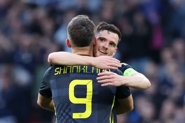 Andy Robertson and Lawrence Shankland hugging