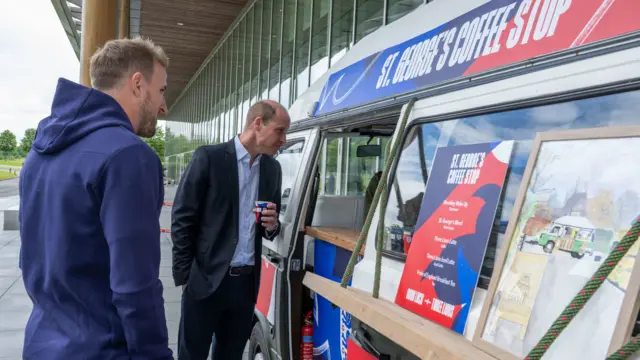 The Prince of Wales ordering a coffee at St. George's Park with England captain Harry Kane