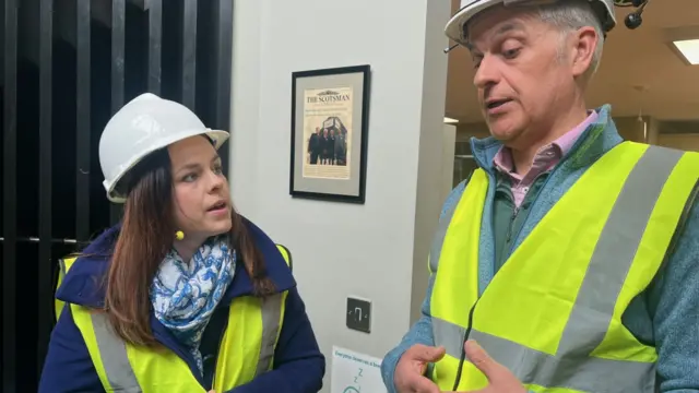 Deputy Scottish First Minister Kate Forbes wears a hi-vis vest and a hard hat